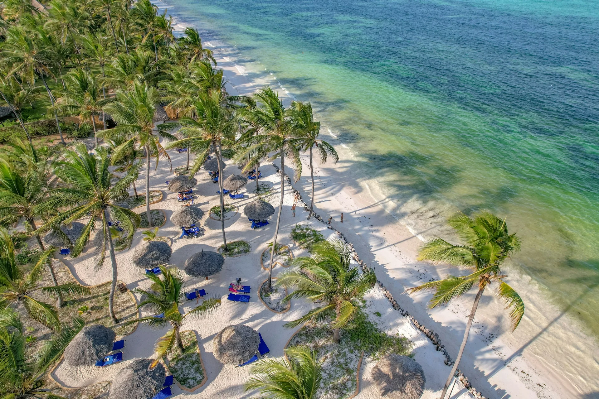 White sand and turquoise Indian Ocean water on the coast of Zanzibar